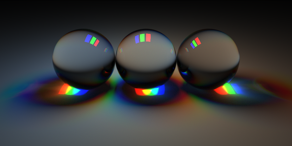 Three lights (one red, green, and blue) illuminating three glass spheres